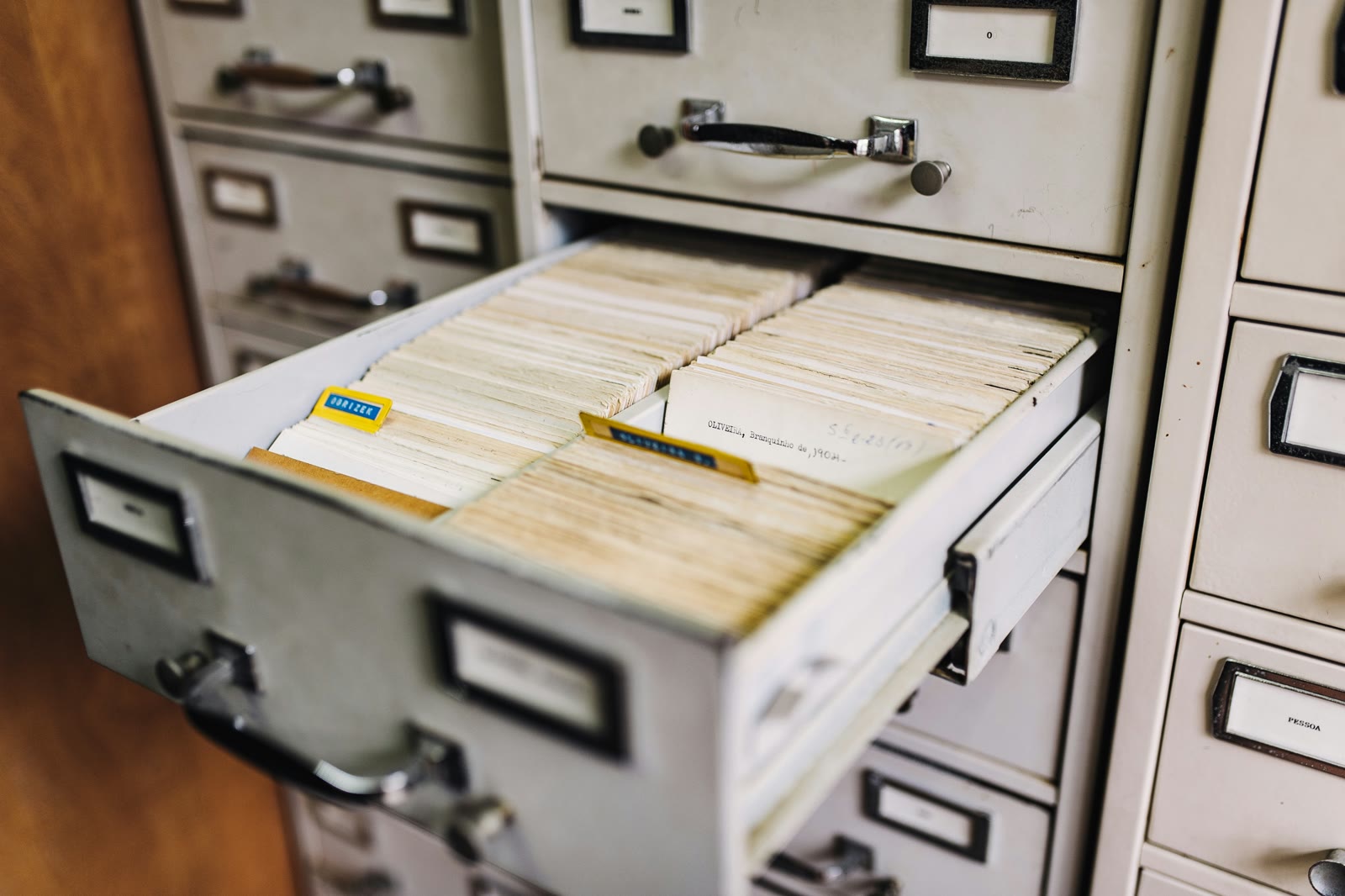 An open card-catalogue drawer packed with filed records